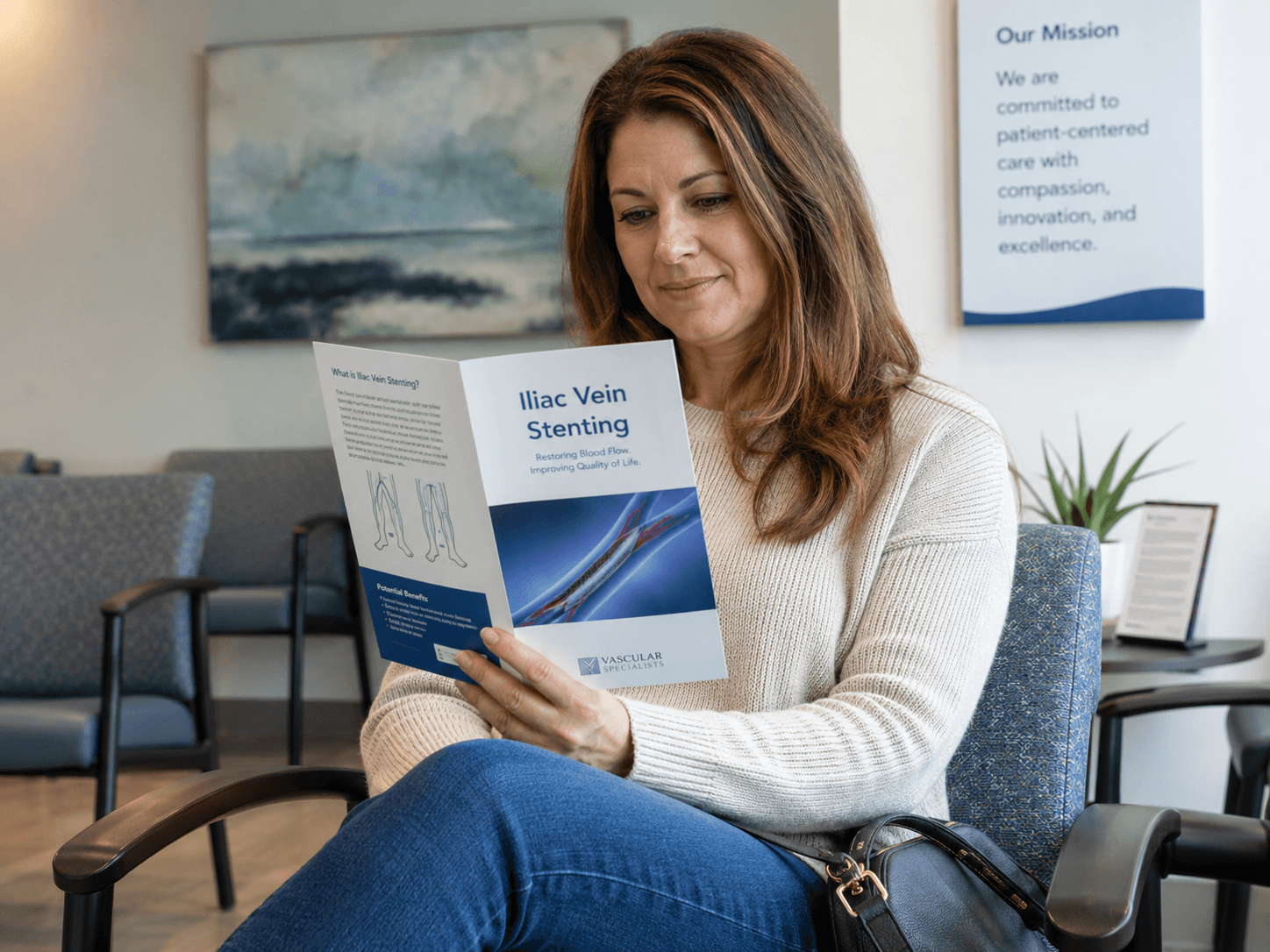 Patient reviewing iliac vein stenting information before treatment