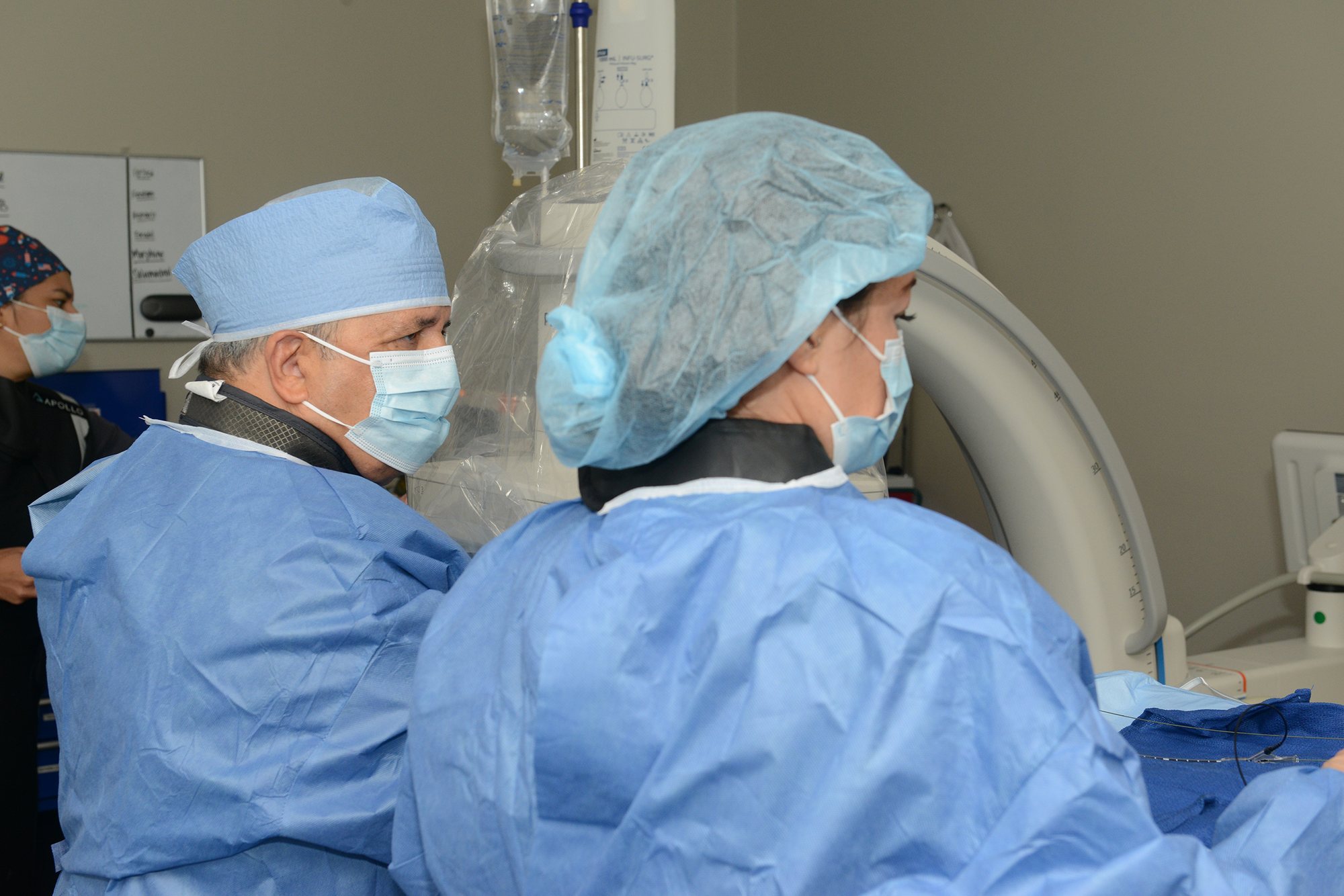 Illiana clinicians at the imaging equipment during a vascular evaluation