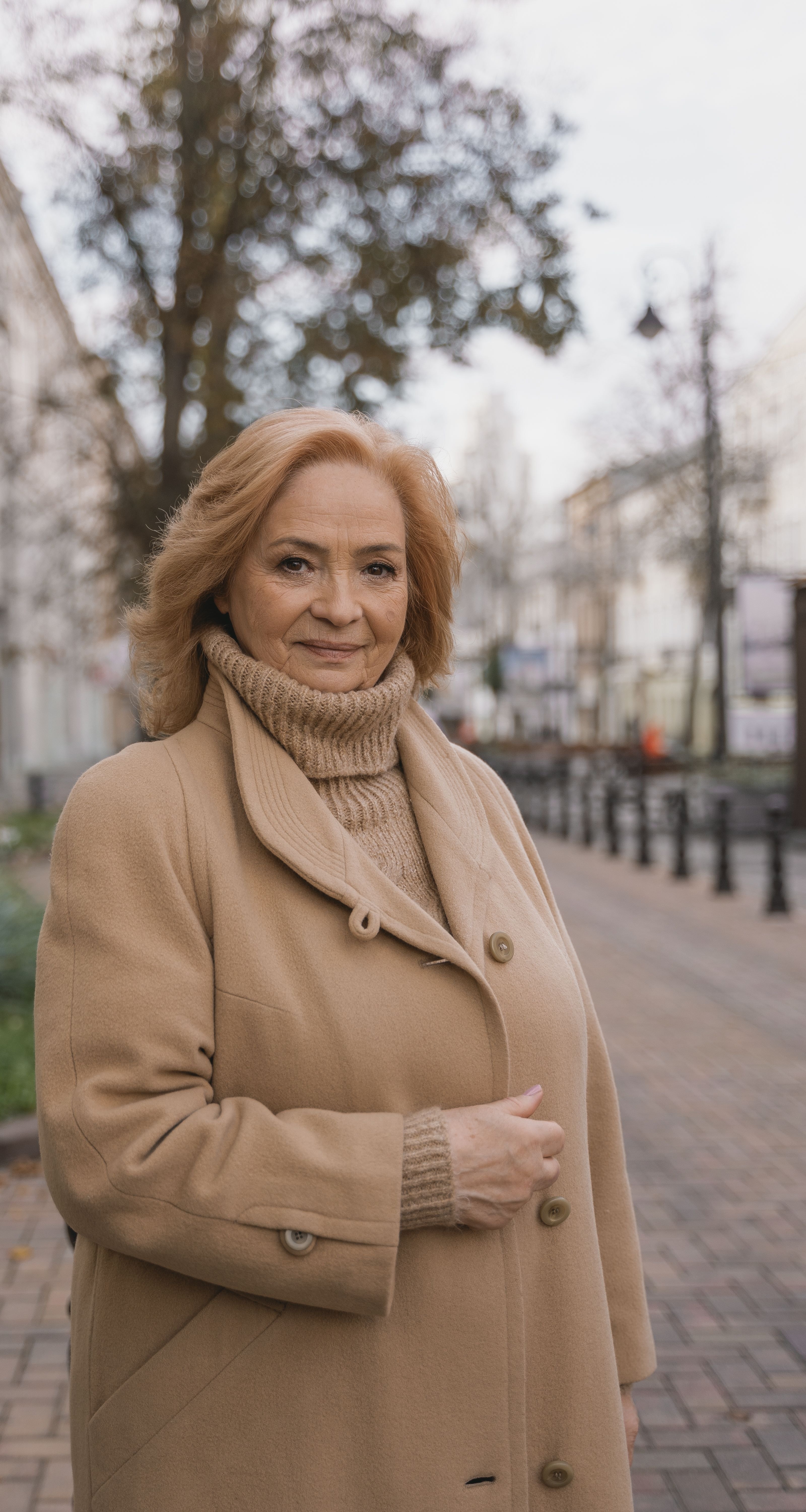 An elegant woman in a warm coat outdoors