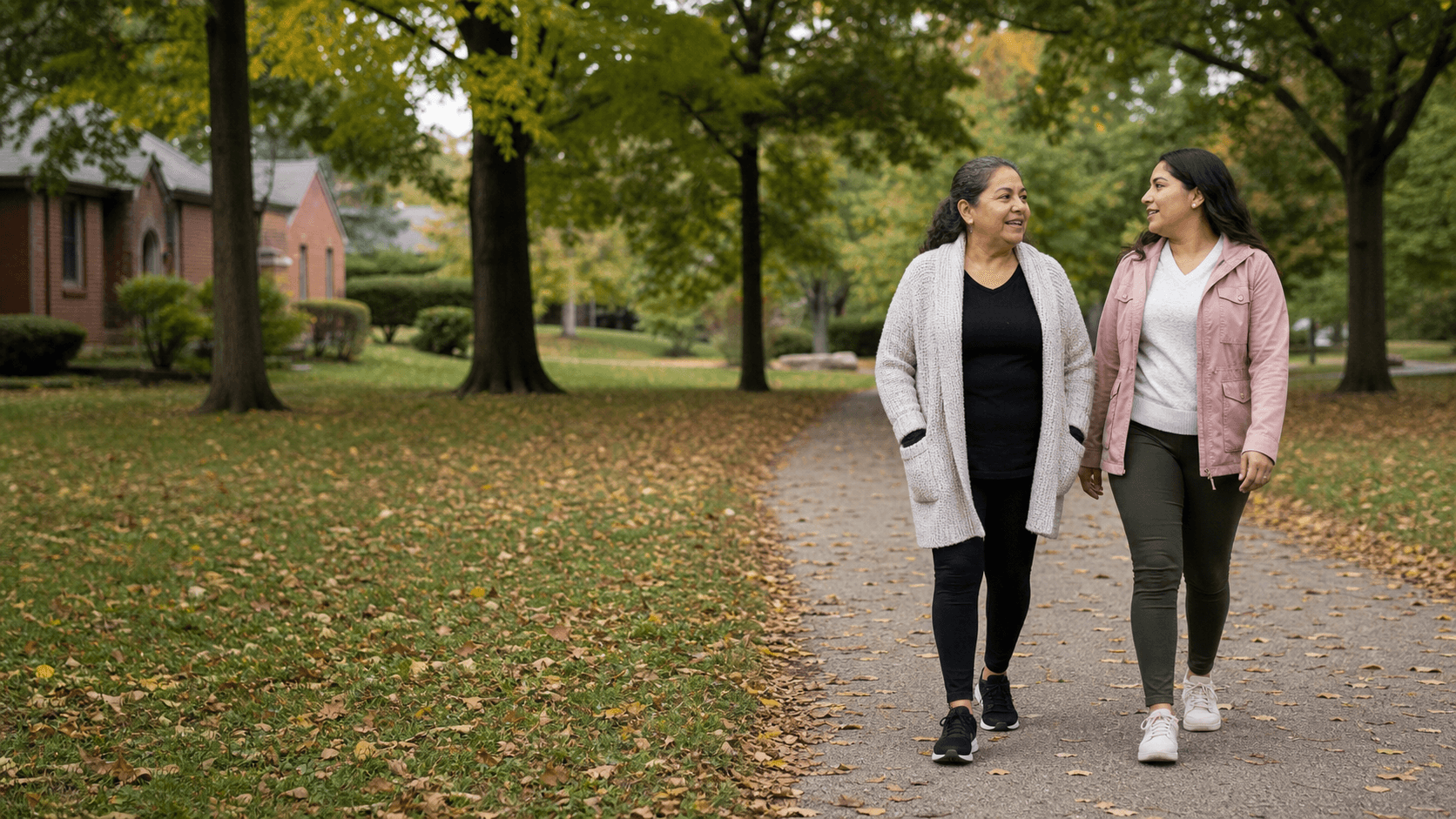A Latina mother and daughter walking together in a Northwest Indiana neighborhood